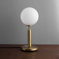 Modern Miira Matte White Glass Globe Table Lamp with Brass Base - view 1