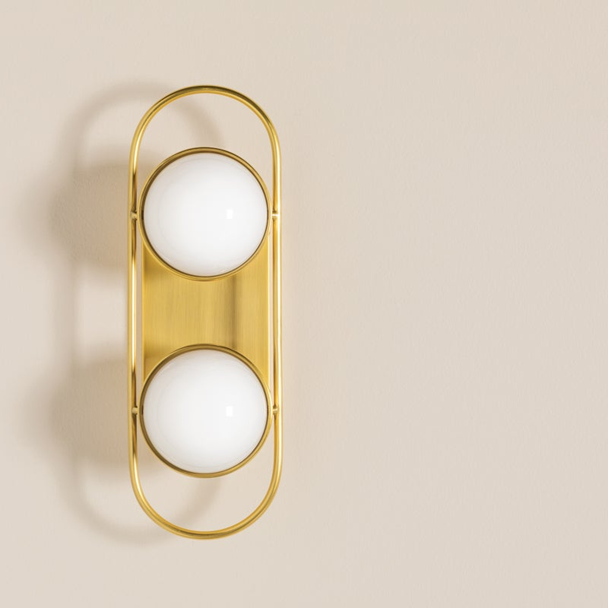 Lyra Aged Brass Globe Vanity Sconce - Warm Ambient Bathroom Light - view 1