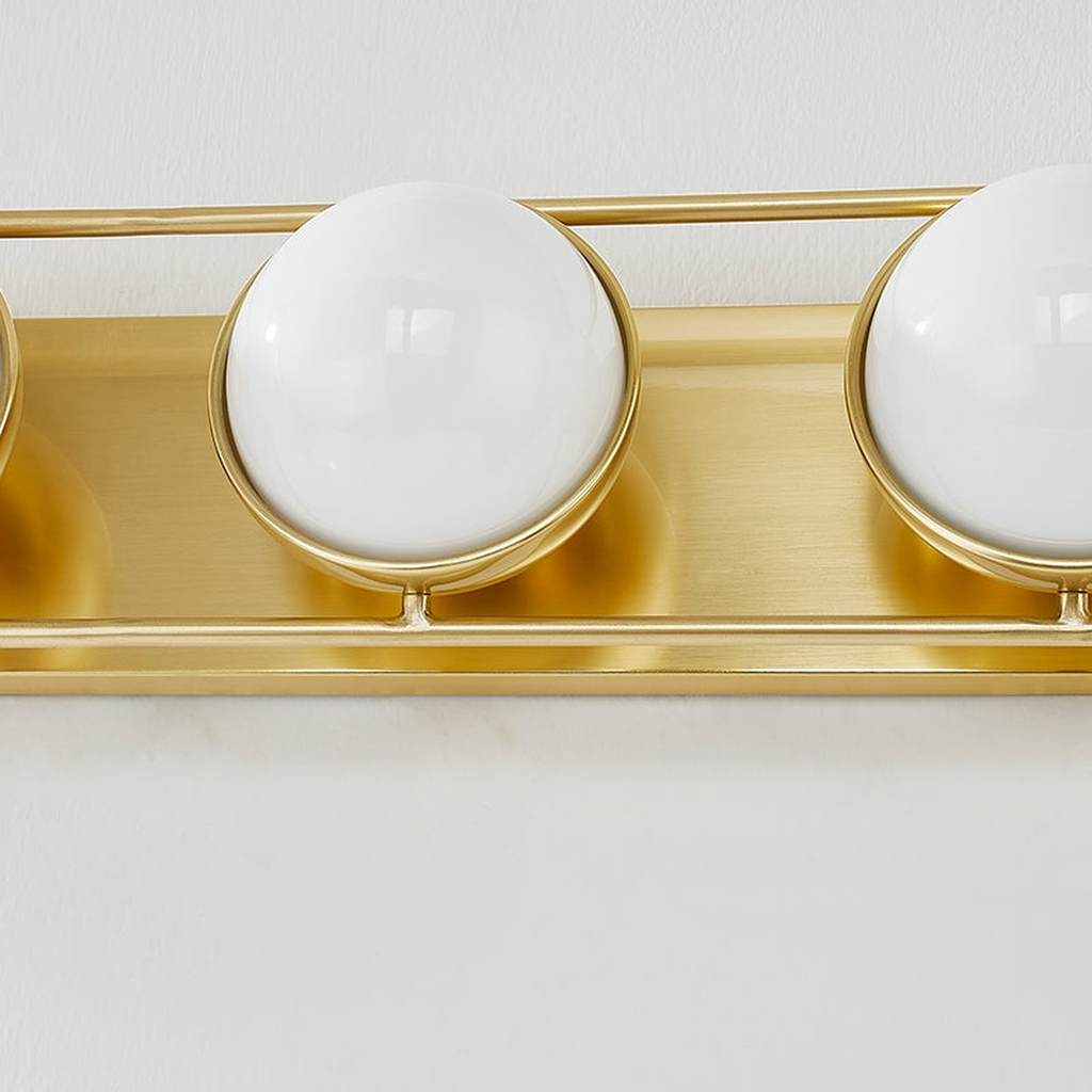 Lyra Aged Brass Globe Vanity Sconce - Warm Ambient Bathroom Light - view 11