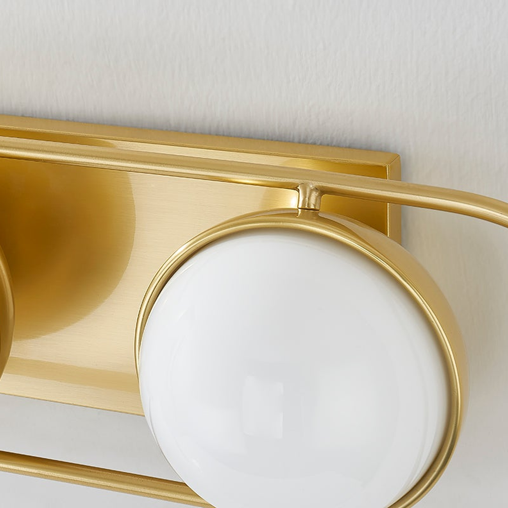 Lyra Aged Brass Globe Vanity Sconce - Warm Ambient Bathroom Light - view 8